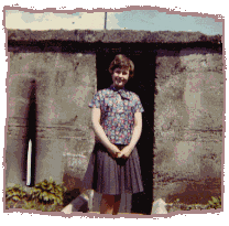 About age 15, in front of our air raid shelter at Hill Street