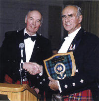 Colonel The Hon. Henry N.R. Jackman being presented with his award