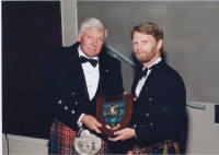 Lynton (Red) Wilson being presented with his award