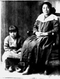 Mertie Rusk is the child on the left, Bertha's half sister. Bertha is on the right.