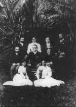 Group photo 'Ainahau grounds; Archibald Cleghorn seated on bench (centre); Ka'iulani seated (right) on lawn
