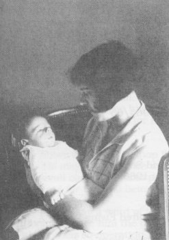 His mother Lydia holding him after his birth in 1929
