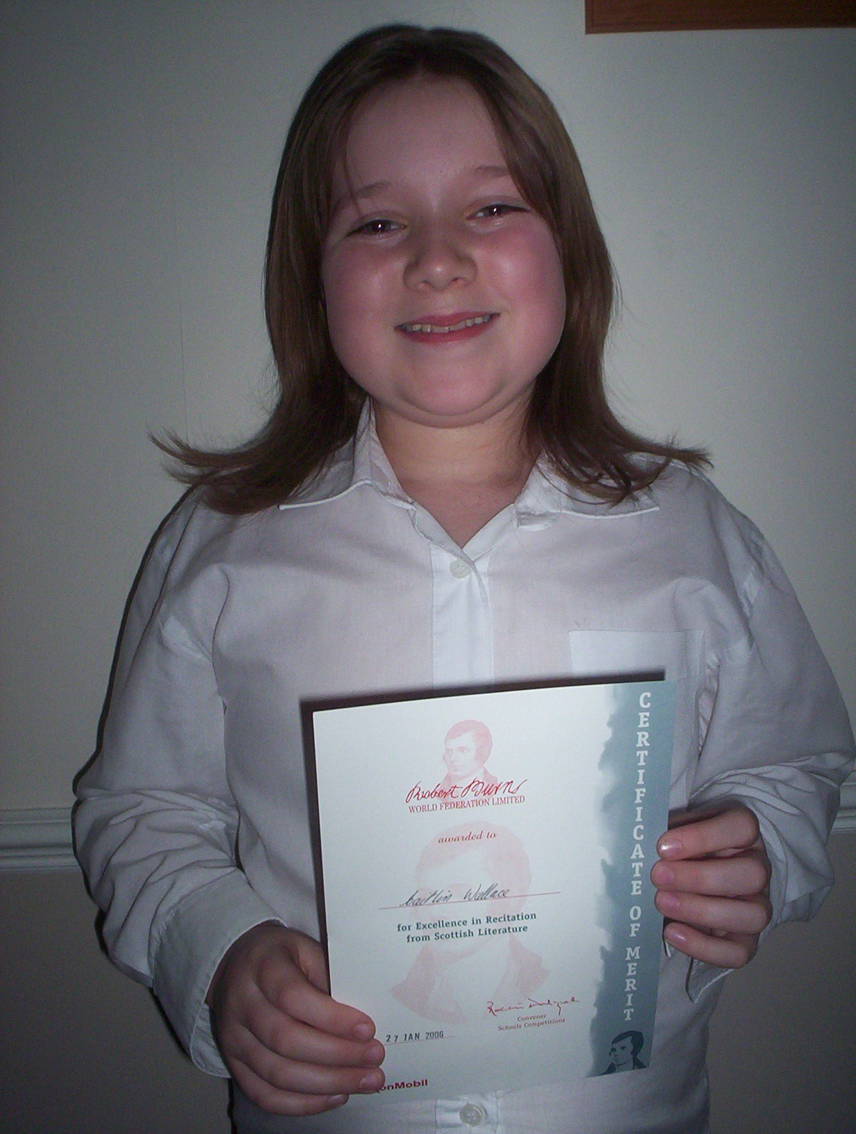 Caitlin Wallace, age 9, with her Robert Burns Certificate of Merit
