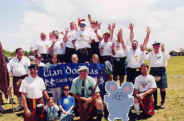 Flat Mouse poses with The Clan Douglas Society No. 1 Tug-o-War team after another victorious competition at Grandfather Mountain Highland Games.