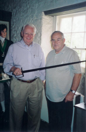 Frank Shaw and Les Byers, curator of Ellisland Farm, is attached showing the sword used by Burns during his time as an exciseman.