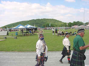 A Crow Indian in full rig, plus tartan sash 