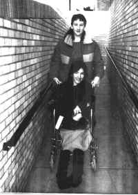Rhonda Louise Flood in wheelchair With sister Kharis E. Flood