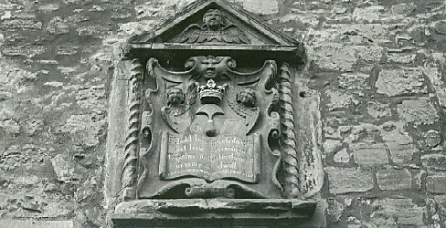 A Sculptured shield including the arms of the Guild of Shoemakers, Canongate, Edinburgh