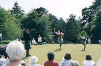Piper and Dancers on the lawn at Brodick Castle