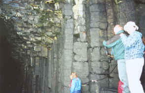 Peggy at the entrance to Fingal's Cave. Note the basalt columns and the ceiling.
