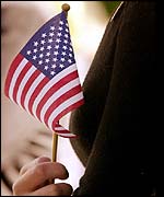 Mourner holding stars and stripes